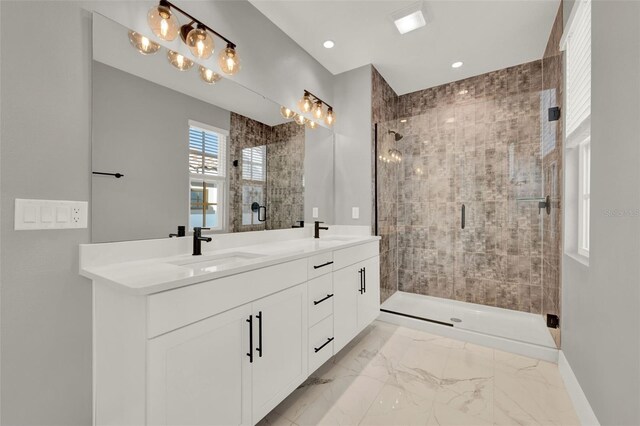 7412 Estuary Lake Loop, Celebration, FL 34747 - bathroom featuring double vanity, a shower stall, marble finish flooring, and recessed lighting