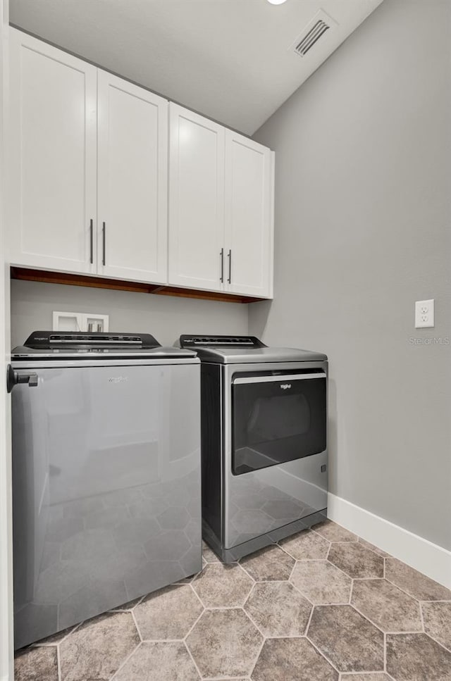 7412 Estuary Lake Loop, Celebration, FL 34747 - laundry area with cabinet space and washer and dryer