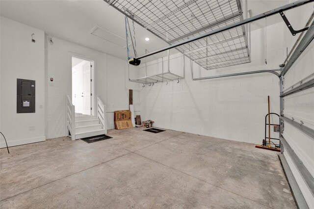 7412 Estuary Lake Loop, Celebration, FL 34747 - garage featuring electric panel, a garage door opener, and concrete block wall
