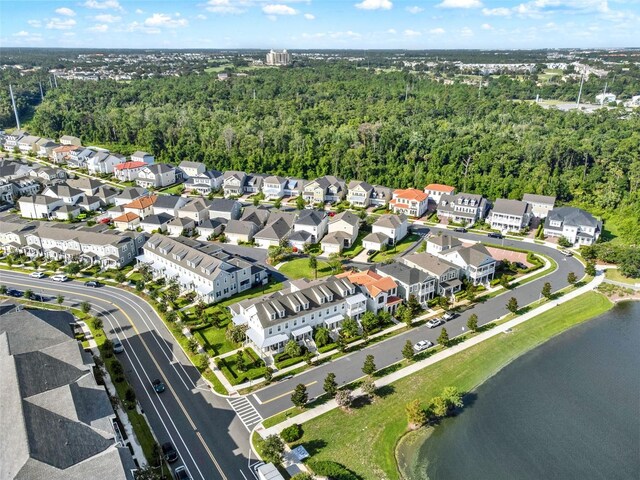 7412 Estuary Lake Loop, Celebration, FL 34747 - aerial view of property and surrounding area featuring a large body of water and nearby suburban area