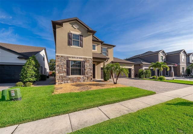 9379 Royal Estates Blvd, Orlando, FL 32836 - view of front of house featuring stone siding, stucco siding, decorative driveway, a front yard, and a residential view