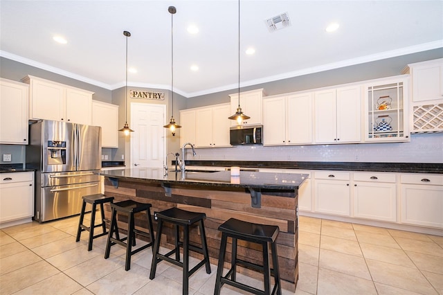 9379 Royal Estates Blvd, Orlando, FL 32836 - kitchen with appliances with stainless steel finishes, light tile patterned floors, ornamental molding, a breakfast bar, and backsplash