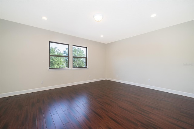 9379 Royal Estates Blvd, Orlando, FL 32836 - unfurnished room with dark wood-style floors and recessed lighting