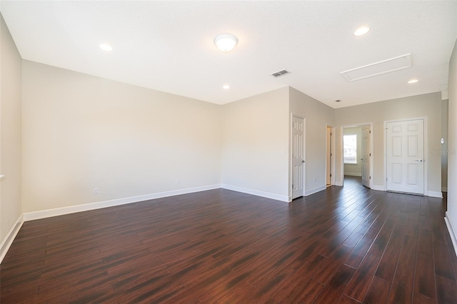 9379 Royal Estates Blvd, Orlando, FL 32836 - spare room featuring dark wood finished floors, attic access, and recessed lighting