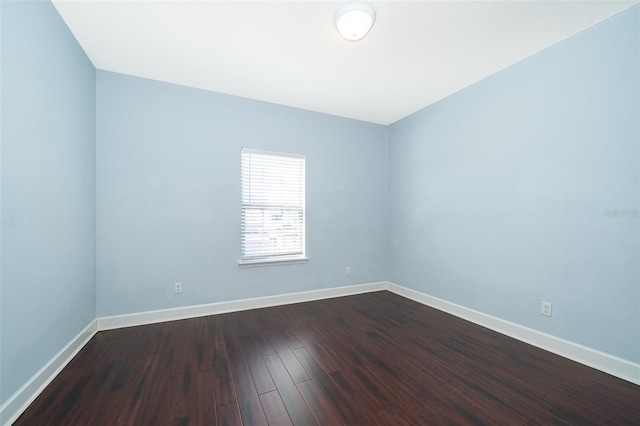 9379 Royal Estates Blvd, Orlando, FL 32836 - unfurnished room featuring baseboards and dark wood-style flooring