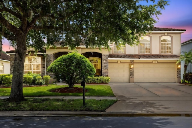 1331 Marble Crest Way, Winter Garden, FL 34787 - view of front of house with stone siding, stucco siding, concrete driveway, and a garage