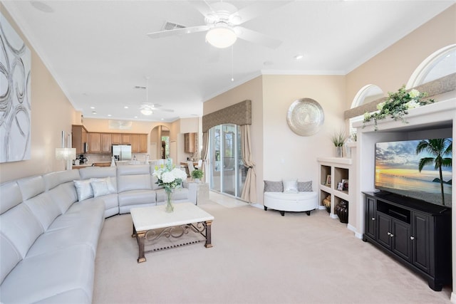 1331 Marble Crest Way, Winter Garden, FL 34787 - living room featuring ceiling fan, ornamental molding, light colored carpet, arched walkways, and recessed lighting