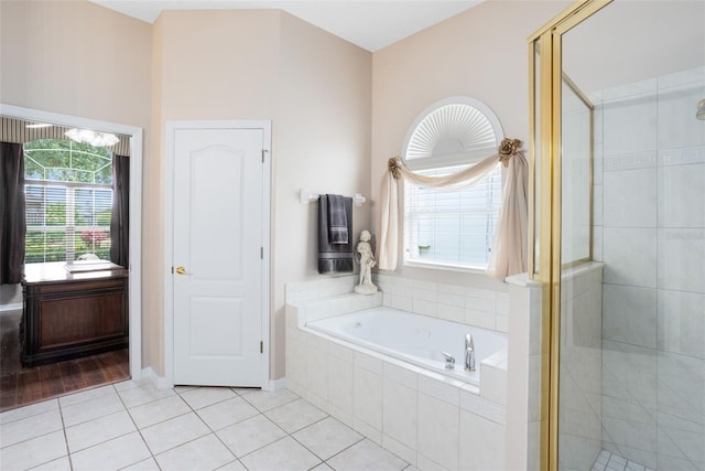 1331 Marble Crest Way, Winter Garden, FL 34787 - bathroom featuring a garden tub, a stall shower, tile patterned floors, and plenty of natural light