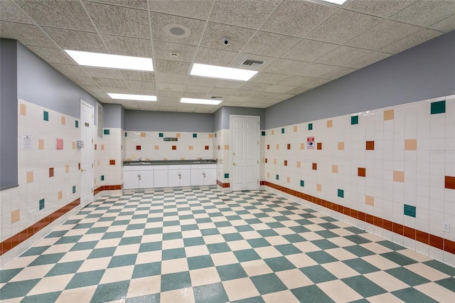 1331 Marble Crest Way, Winter Garden, FL 34787 - unfurnished room with tile walls, a paneled ceiling, and tile patterned floors