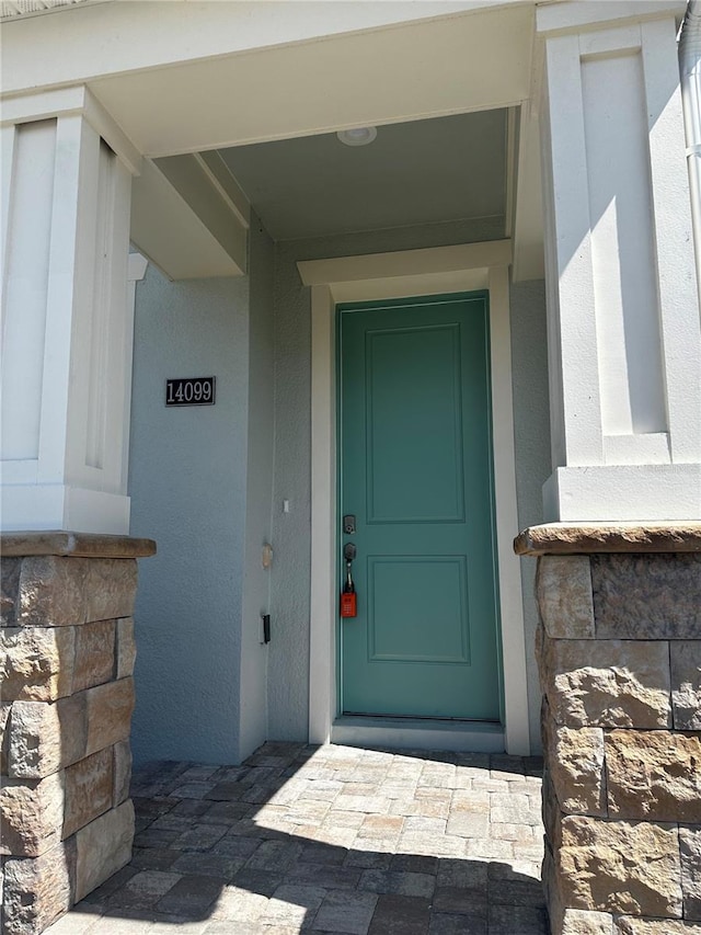 14099 Lochend Way, Winter Garden, FL 34787 - view of exterior entry with stone siding
