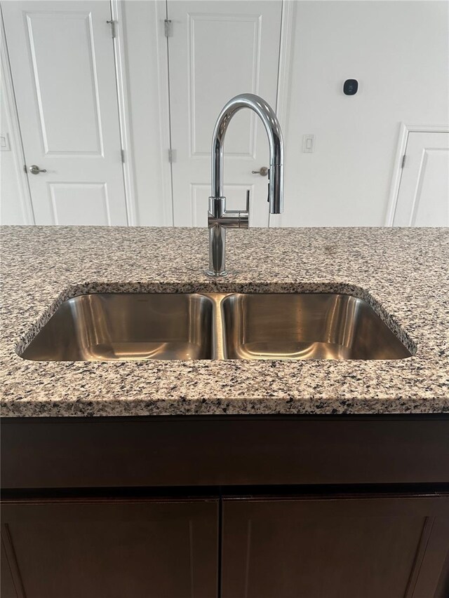 14099 Lochend Way, Winter Garden, FL 34787 - kitchen view of dark brown cabinets and light stone countertops