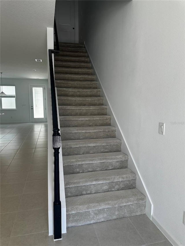14099 Lochend Way, Winter Garden, FL 34787 - staircase with tile patterned flooring and baseboards
