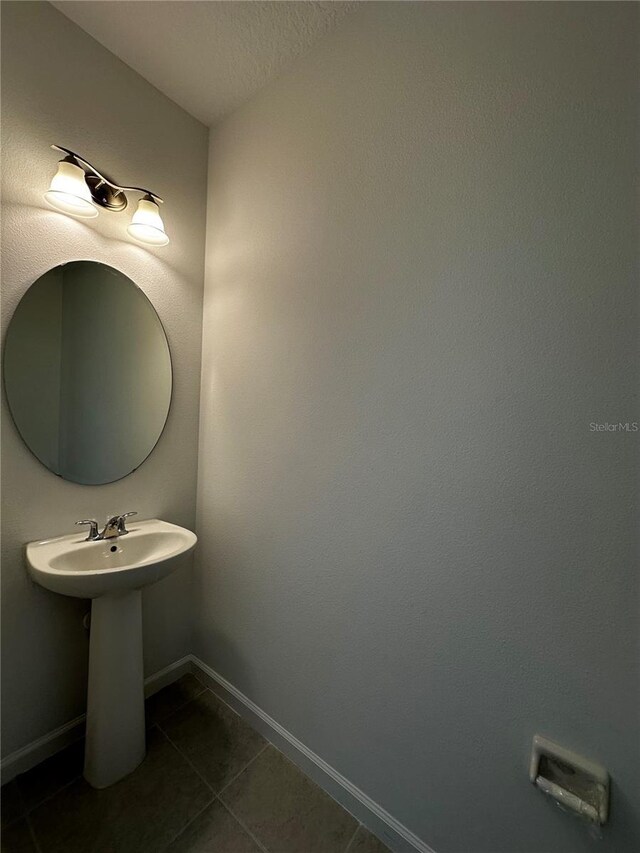 14099 Lochend Way, Winter Garden, FL 34787 - bathroom with tile patterned floors and baseboards