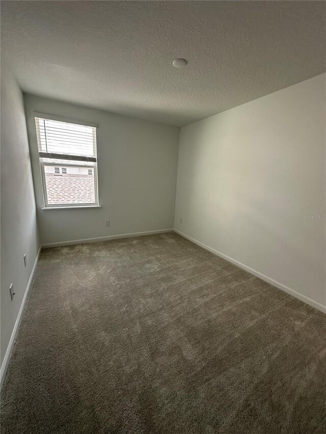 14099 Lochend Way, Winter Garden, FL 34787 - carpeted empty room featuring a textured ceiling and baseboards