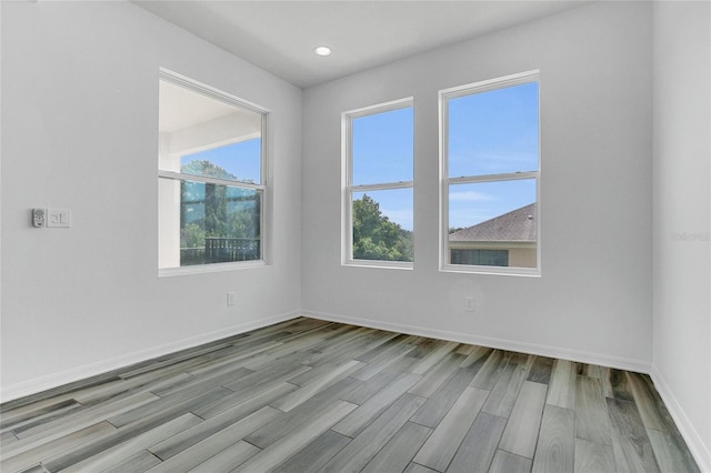 17458 Chateau Pine Way, Clermont, FL 34711 - spare room with wood finished floors and recessed lighting