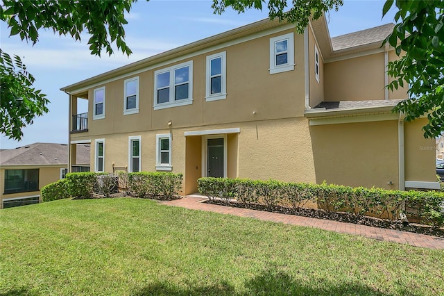 17458 Chateau Pine Way, Clermont, FL 34711 - view of front of property with stucco siding and a front yard