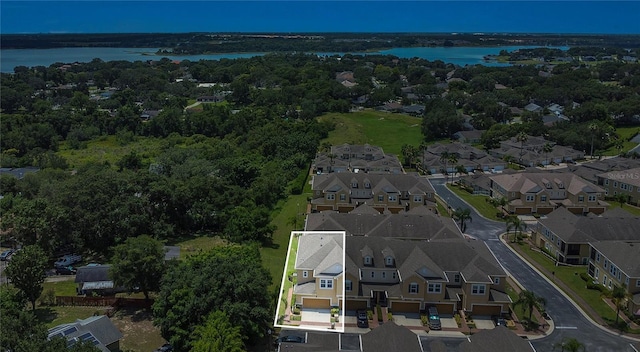 17458 Chateau Pine Way, Clermont, FL 34711 - aerial perspective of suburban area with a nearby body of water and property parcel outlined
