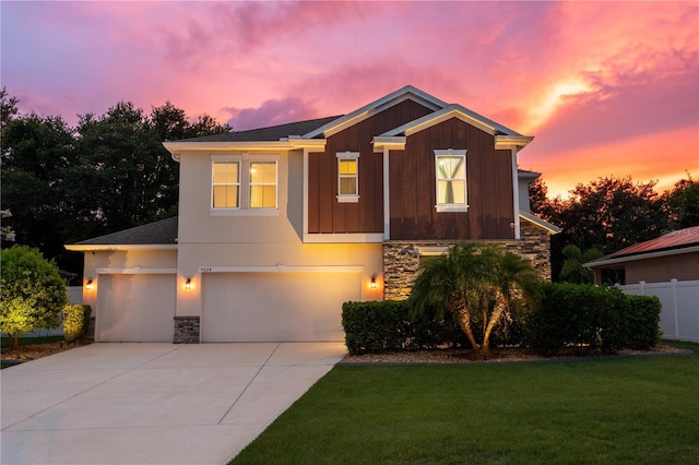 4024 Blazewater Ct, Eustis, FL 32736 - view of front of property with stone siding, an attached garage, concrete driveway, and board and batten siding