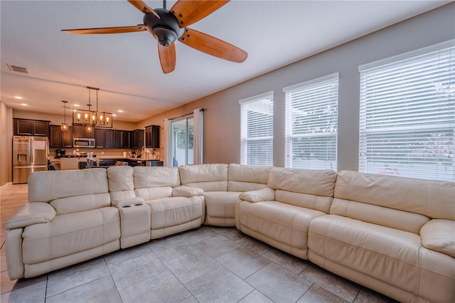 4024 Blazewater Ct, Eustis, FL 32736 - living room with healthy amount of natural light, ceiling fan, and light tile patterned flooring