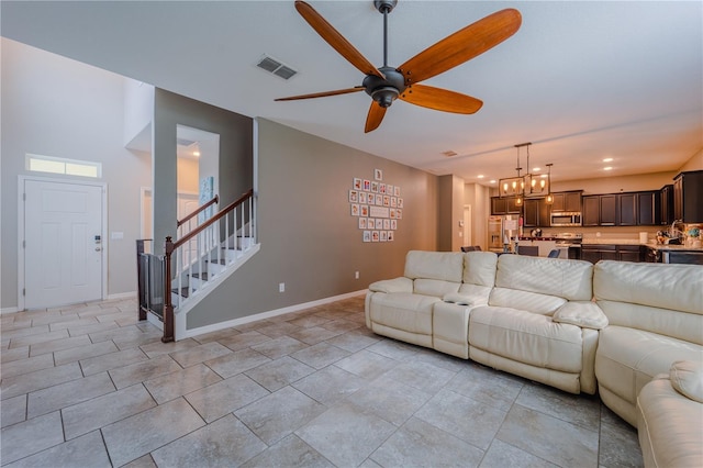 4024 Blazewater Ct, Eustis, FL 32736 - living room with stairs, ceiling fan, and recessed lighting