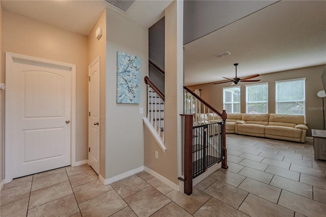 4024 Blazewater Ct, Eustis, FL 32736 - staircase featuring a ceiling fan and tile patterned flooring