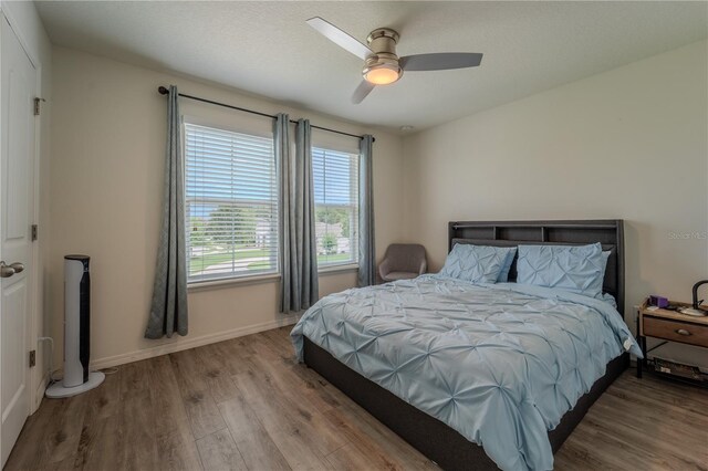 4024 Blazewater Ct, Eustis, FL 32736 - bedroom with wood finished floors and ceiling fan