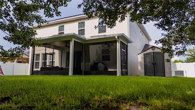 4024 Blazewater Ct, Eustis, FL 32736 - rear view of property with a ceiling fan, a sunroom, a storage unit, and stucco siding