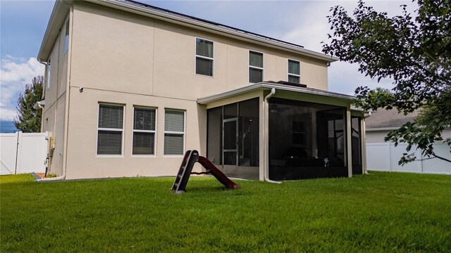 4024 Blazewater Ct, Eustis, FL 32736 - back of house featuring a sunroom and stucco siding