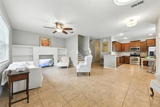 1551 Scarlet Oak Loop Unit B, Winter Garden, FL 34787 - living area featuring a ceiling fan, light tile patterned flooring, stairway, and recessed lighting
