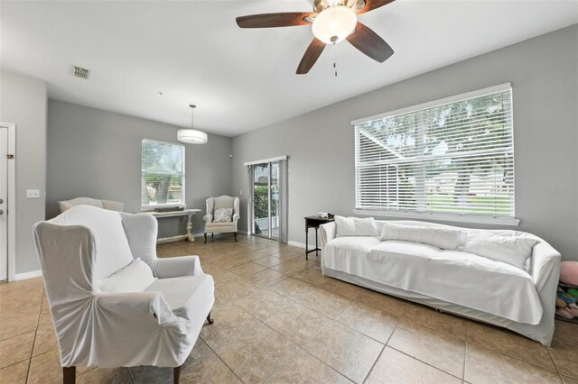 1551 Scarlet Oak Loop Unit B, Winter Garden, FL 34787 - living room with light tile patterned floors and a ceiling fan