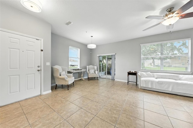 1551 Scarlet Oak Loop Unit B, Winter Garden, FL 34787 - living area featuring light tile patterned flooring and ceiling fan
