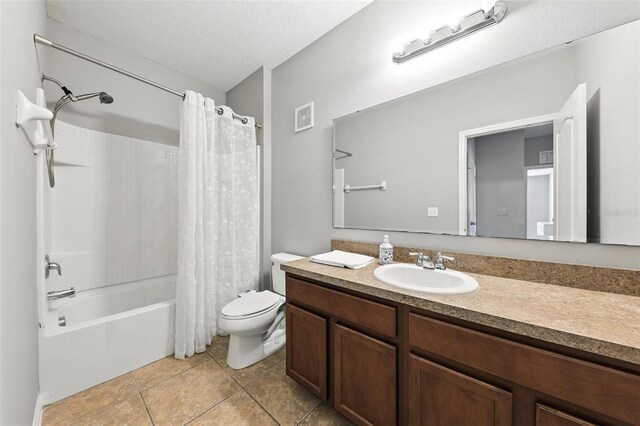 1551 Scarlet Oak Loop Unit B, Winter Garden, FL 34787 - full bathroom with vanity, shower / bath combo, tile patterned flooring, and a textured ceiling