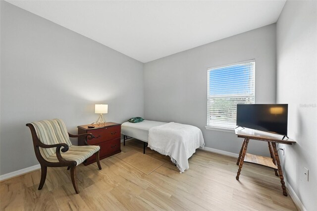 1551 Scarlet Oak Loop Unit B, Winter Garden, FL 34787 - bedroom featuring light wood-style floors and baseboards