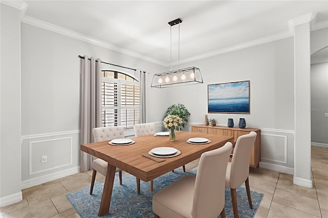 32619 View Haven Ln, Sorrento, FL 32776 - dining area featuring light tile patterned floors, crown molding, a decorative wall, and wainscoting