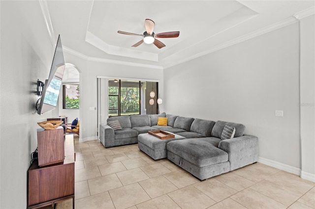 32619 View Haven Ln, Sorrento, FL 32776 - living area featuring a tray ceiling, a ceiling fan, light tile patterned floors, arched walkways, and ornamental molding
