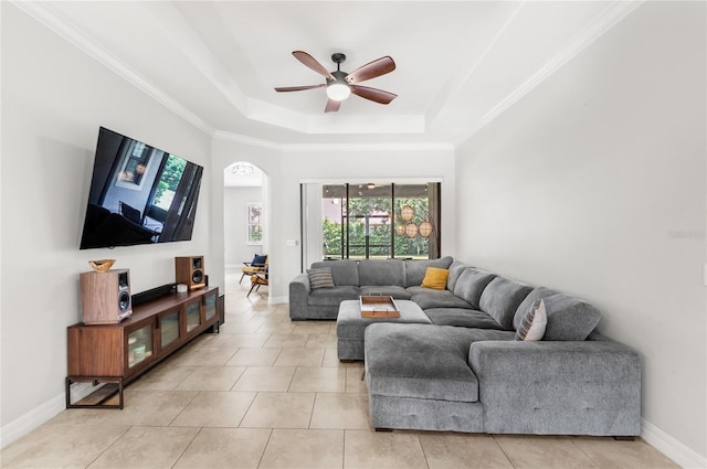 32619 View Haven Ln, Sorrento, FL 32776 - living room featuring a tray ceiling, ceiling fan, light tile patterned floors, and crown molding