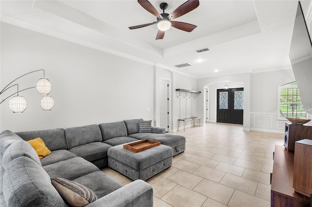 32619 View Haven Ln, Sorrento, FL 32776 - living area featuring arched walkways, a raised ceiling, light tile patterned floors, a ceiling fan, and a decorative wall