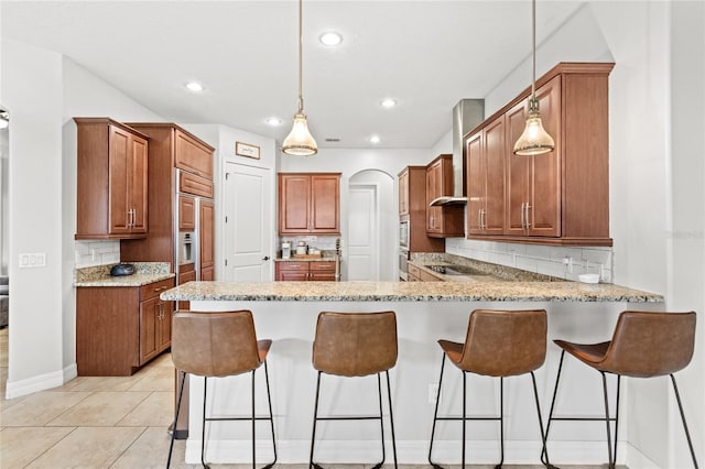 32619 View Haven Ln, Sorrento, FL 32776 - kitchen with a peninsula, tasteful backsplash, electric stovetop, wall chimney exhaust hood, and decorative light fixtures