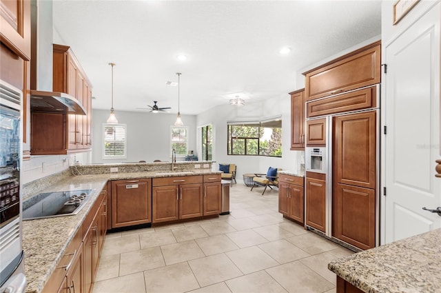 32619 View Haven Ln, Sorrento, FL 32776 - kitchen featuring black electric stovetop, paneled built in refrigerator, healthy amount of natural light, a peninsula, and recessed lighting