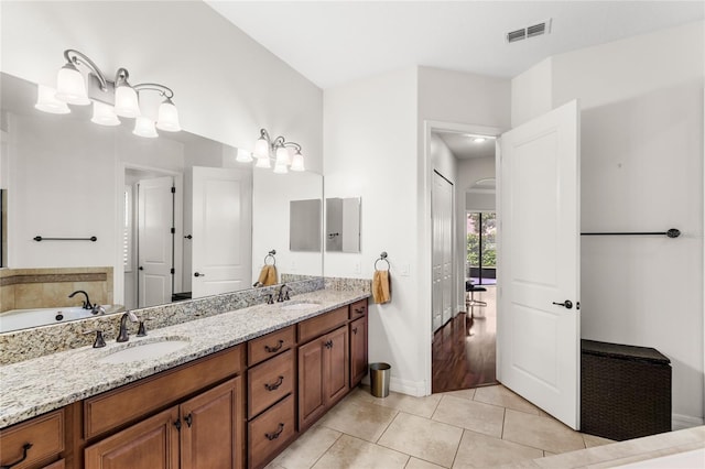 32619 View Haven Ln, Sorrento, FL 32776 - full bathroom with double vanity and tile patterned flooring