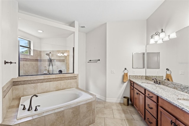 32619 View Haven Ln, Sorrento, FL 32776 - bathroom featuring double vanity, a garden tub, a walk in shower, and tile patterned flooring