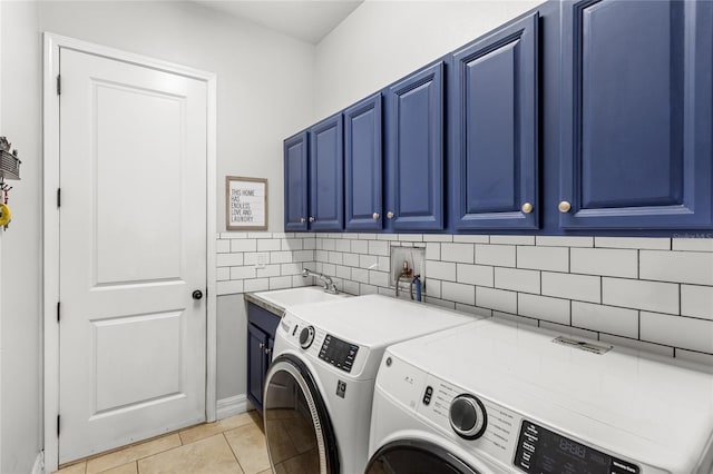 32619 View Haven Ln, Sorrento, FL 32776 - laundry room featuring cabinet space, washer and clothes dryer, and light tile patterned floors