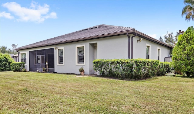32619 View Haven Ln, Sorrento, FL 32776 - back of house featuring stucco siding, a yard, a sunroom, and a tile roof