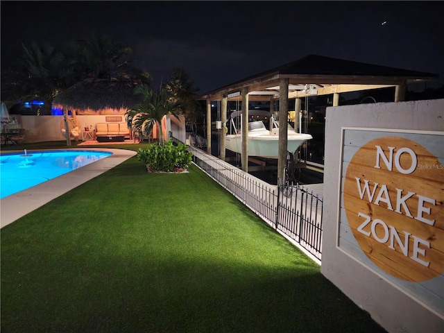 142 Reef Rd, South Daytona, FL 32119 - pool at twilight with boat lift and a dock