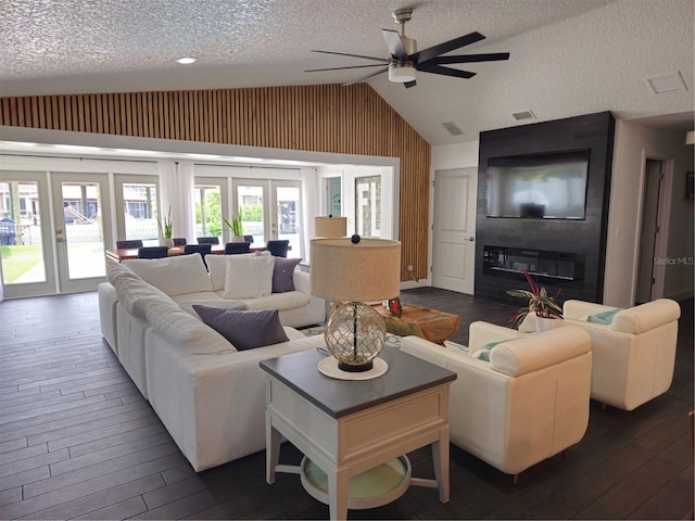 142 Reef Rd, South Daytona, FL 32119 - living area with french doors, vaulted ceiling, a textured ceiling, dark wood-style floors, and ceiling fan