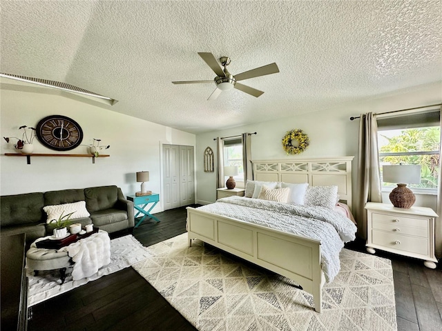 142 Reef Rd, South Daytona, FL 32119 - bedroom featuring wood finished floors, a textured ceiling, a closet, and ceiling fan