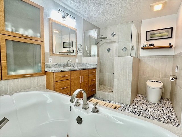 142 Reef Rd, South Daytona, FL 32119 - bathroom with tile walls, a walk in shower, vanity, a jetted tub, and a textured ceiling