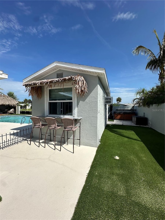 142 Reef Rd, South Daytona, FL 32119 - view of property exterior featuring stucco siding and a patio