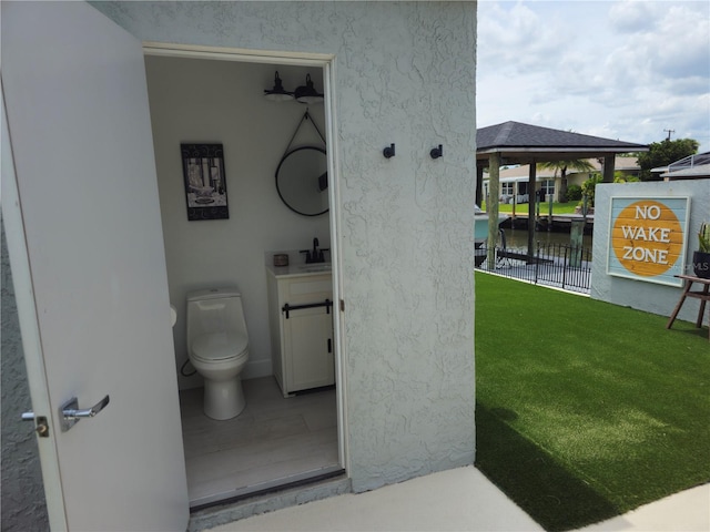 142 Reef Rd, South Daytona, FL 32119 - bathroom featuring a water view and vanity
