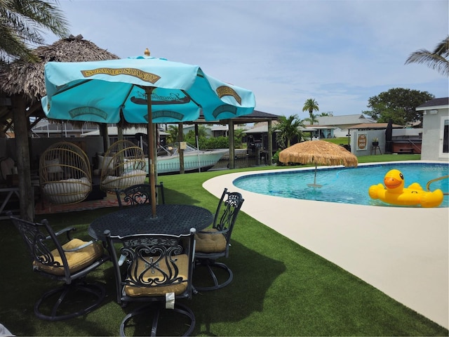 142 Reef Rd, South Daytona, FL 32119 - swimming pool featuring a patio area
